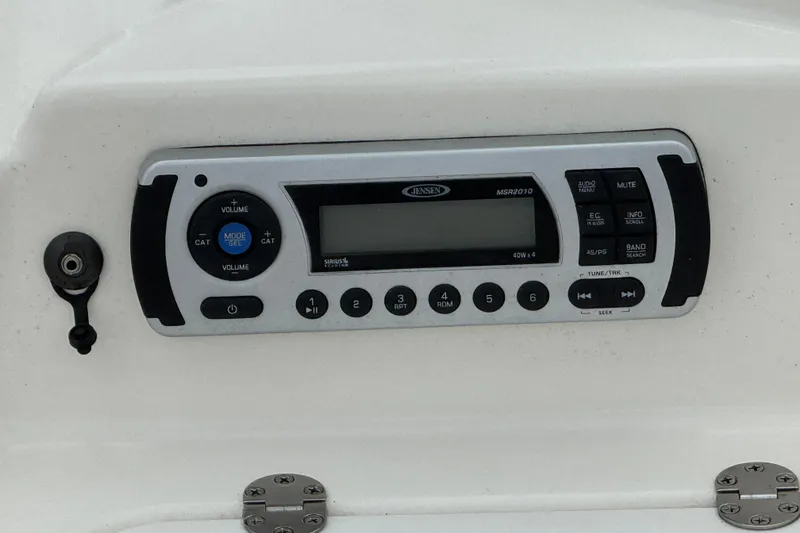Slide: The Image of Control panel of a Jensen MSR2010 stereo system on a 2010 Larson LX 1750 boat. - 8