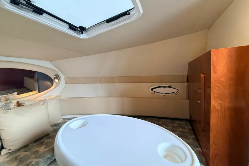Slide: The Image of Interior cabin of 2007 Glastron GS 279 boat with table and cushions. - 21