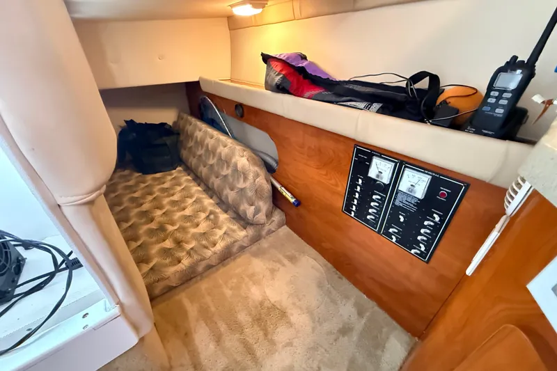 Slide: The Image of 2007 Glastron GS 279 cabin interior with control panels and storage area. - 23