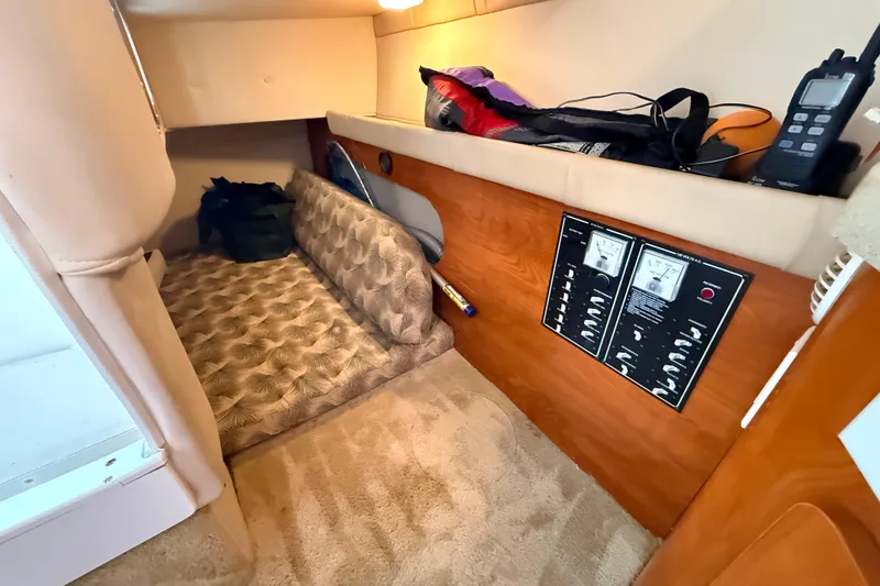 Slide: The Image of 2007 Glastron GS 279 cabin interior with control panel and storage area. - 24