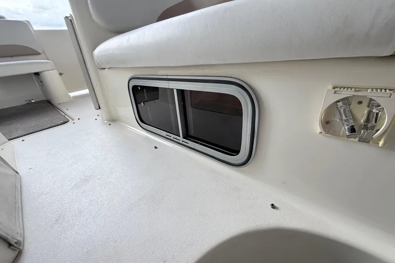 Slide: The Image of 2007 Glastron GS 279 boat interior with seating and window detail. - 31