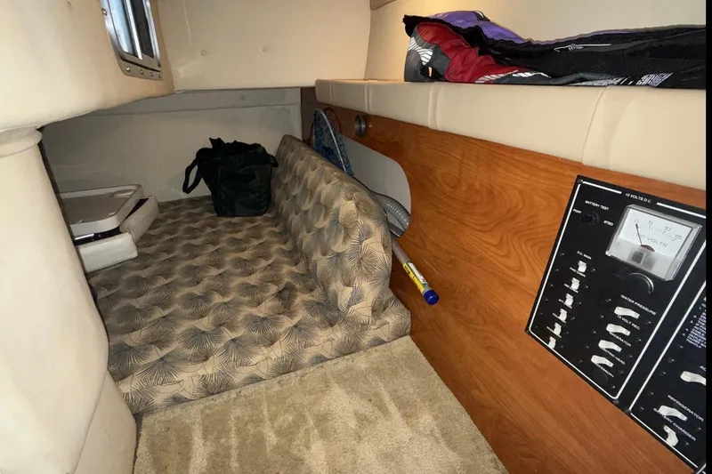 Slide: The Image of 2007 Glastron GS 279 cabin interior with control panel and seating area. - 36