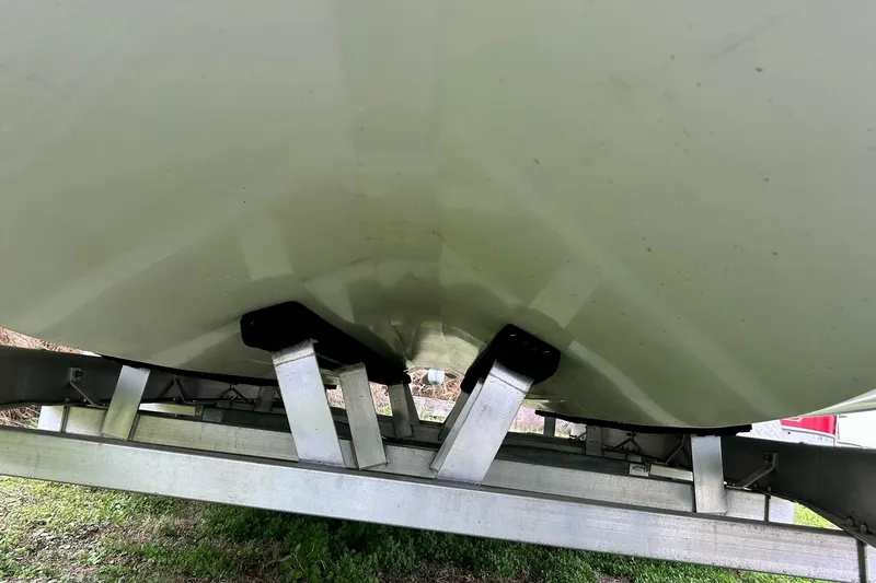 Slide: The Image of Underside view of 2022 Transcat 200 SVT boat on trailer. - 11
