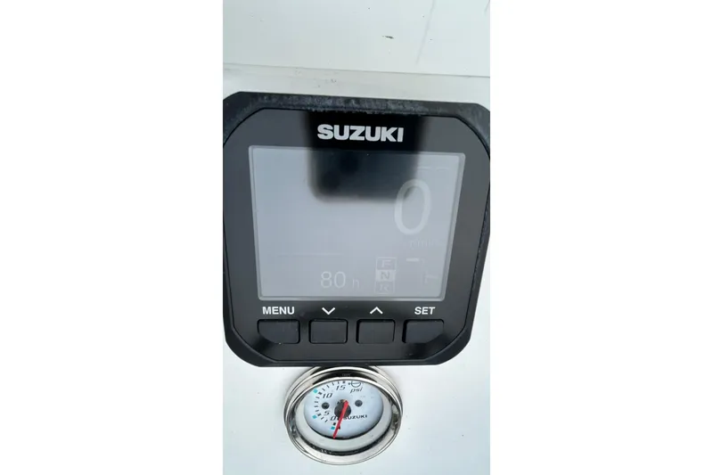 Slide: The Image of Digital display and gauge on a 2022 Transcat 200 SVT boat dashboard. - 20