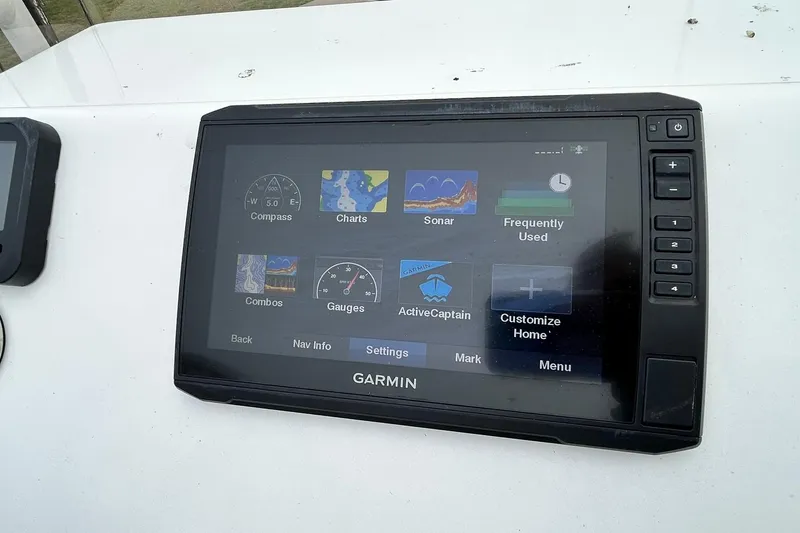 Slide: The Image of Garmin marine navigation display on 2022 Transcat 200 SVT boat dashboard. - 22