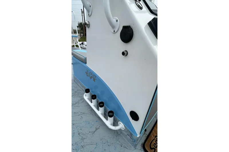 Slide: The Image of 2022 Transcat 200 SVT boat detail with rod holders and sleek design. - 23