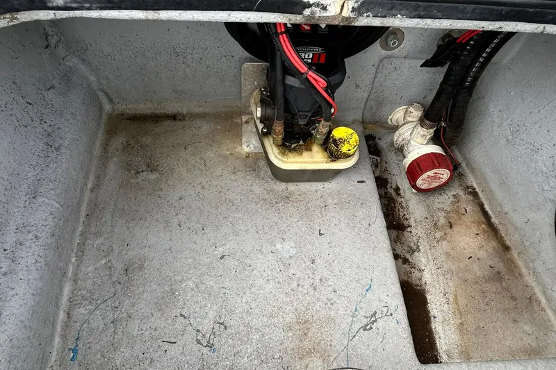 Slide: The Image of Bilge area of a 2022 Transcat 200 SVT boat with wiring and components. - 26