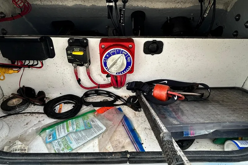 Slide: The Image of Electrical panel and tools inside a 2022 Transcat 200 SVT boat compartment. - 28