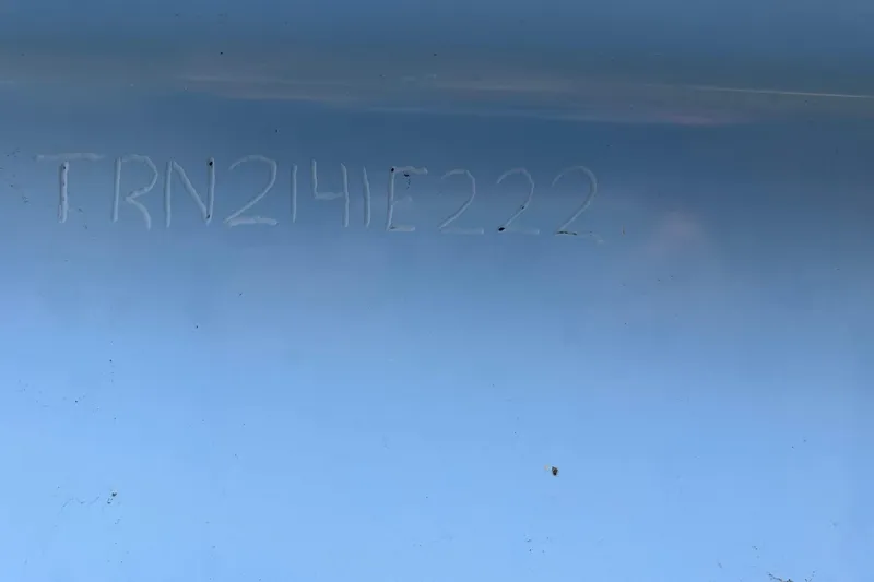 Slide: The Image of Engraved code "TRN214IE222" on blue surface, Transcat 200 SVT 2022 model. - 32