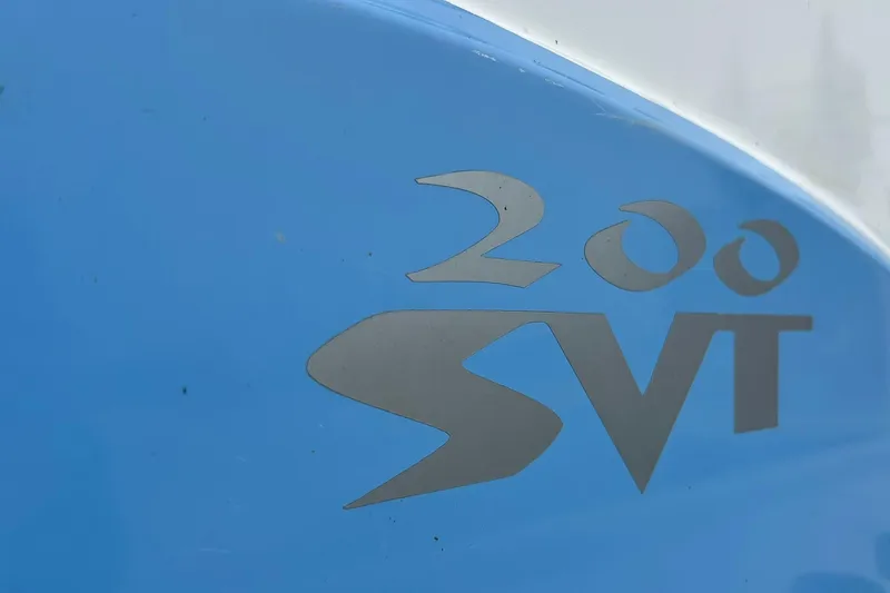 Slide: The Image of Close-up of 2022 Transcat 200 SVT logo on blue surface. - 33