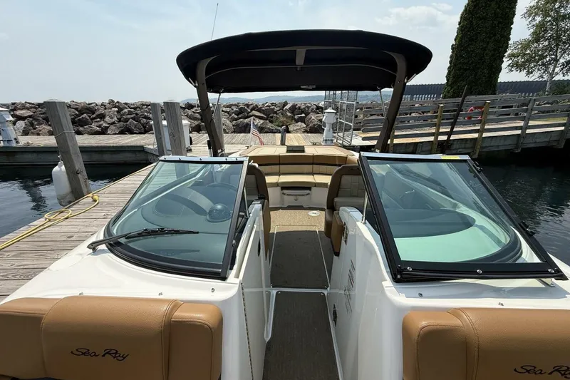 Slide: The Image of 2016 Sea Ray SLX 250 boat docked, featuring open cockpit and sleek design. - 12