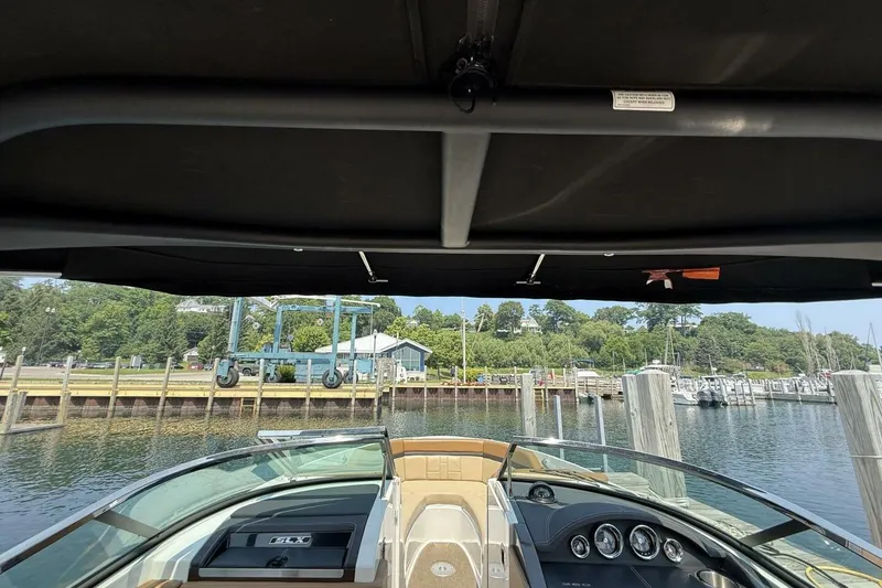 Slide: The Image of 2016 Sea Ray SLX 250 boat interior view at marina dock. - 24