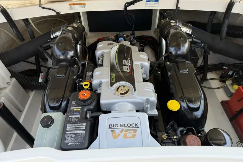 Slide: The Image of Engine compartment of a 2016 Sea Ray SLX 250 with a big block V8 engine. - 36