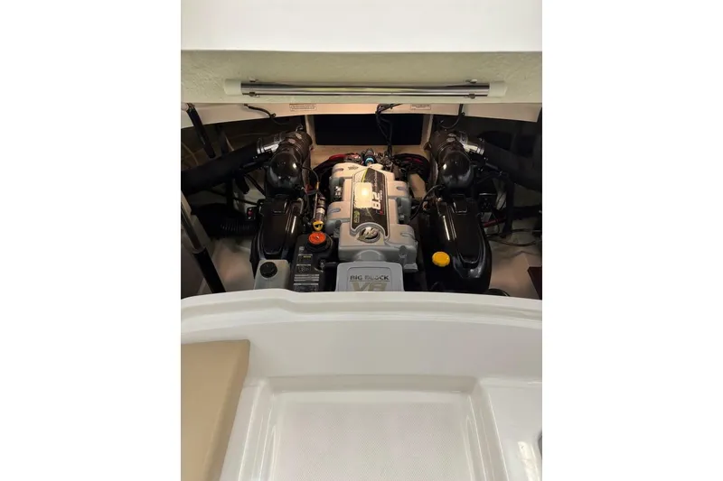 Slide: The Image of Engine compartment of a 2016 Sea Ray SLX 250 boat, showcasing detailed components. - 37