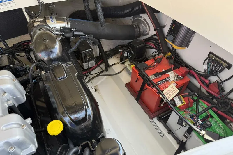 Slide: The Image of Engine compartment of a 2016 Sea Ray SLX 250 boat, showing battery and wiring. - 39