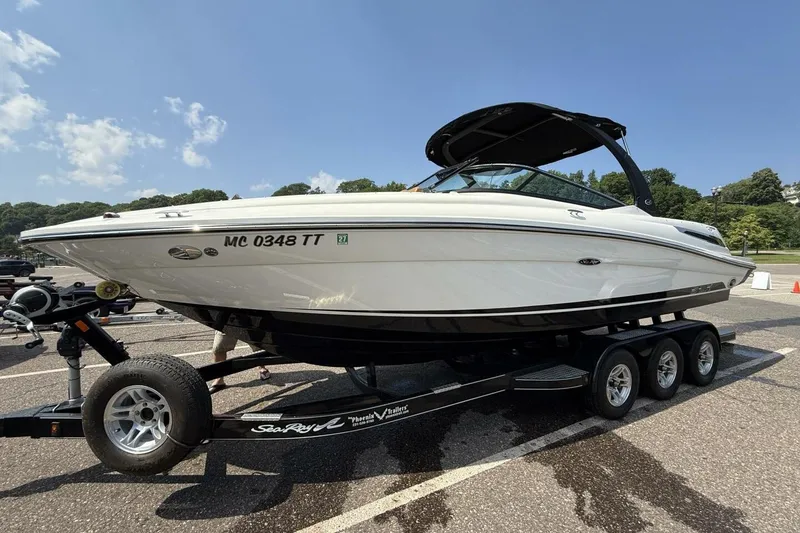 Slide: The Image of 2016 Sea Ray SLX 250 boat on trailer in sunny parking lot. - 47