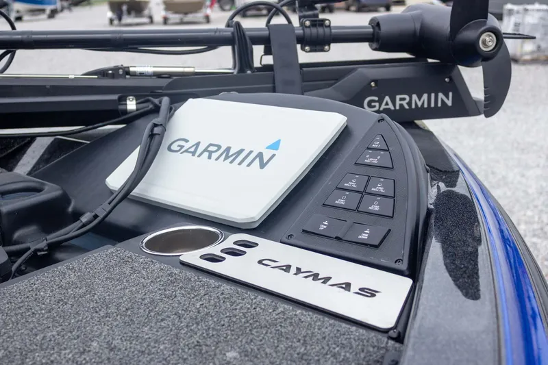 Slide: The Image of 2023 Caymas CX 21 PRO boat dashboard featuring Garmin electronics and control panel. - 20