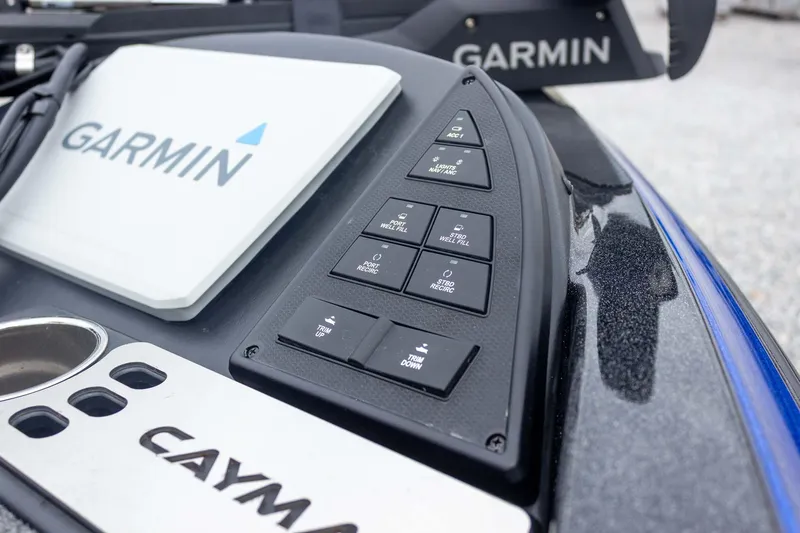 Slide: The Image of 2023 Caymas CX 21 PRO boat dashboard with Garmin navigation system and control panel. - 21