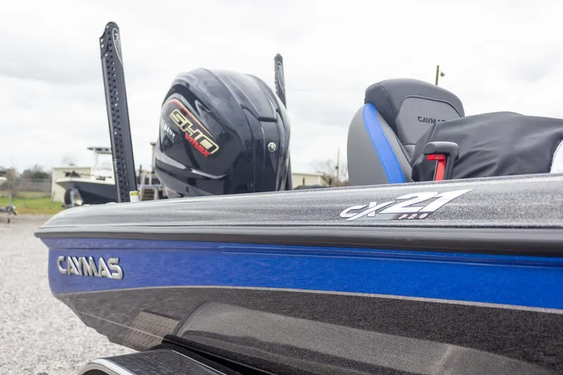 Slide: The Image of 2023 Caymas CX 21 PRO boat with Yamaha engine, blue and black design. - 23