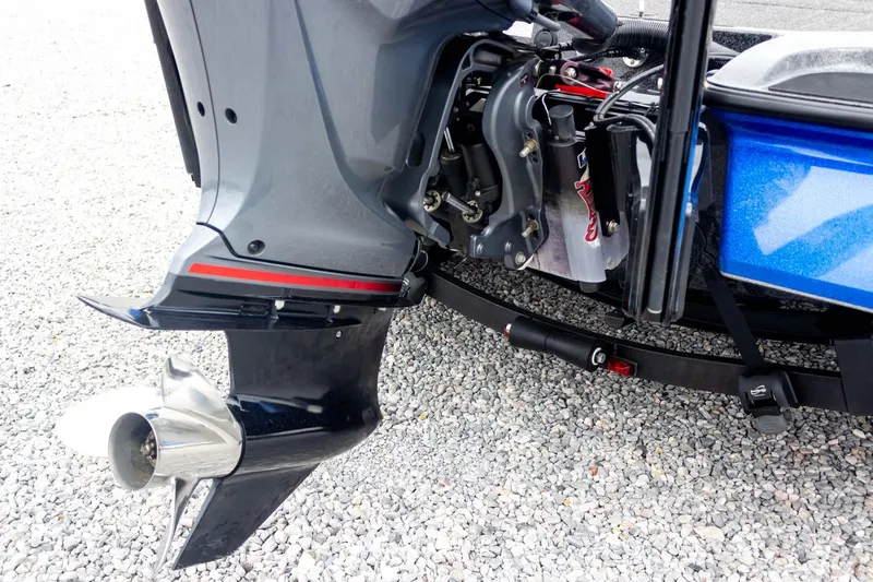 Slide: The Image of 2023 Caymas CX 21 PRO boat motor and propeller on gravel surface. - 25