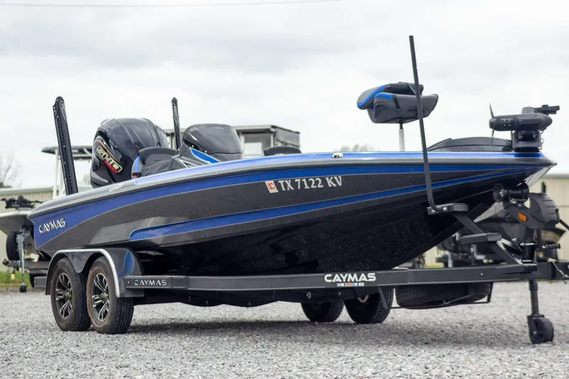Slide: The Image of 2023 Caymas CX 21 PRO boat on trailer, featuring sleek design and modern equipment. - 3