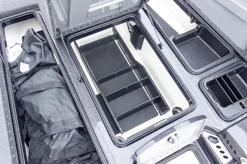 Slide: The Image of 2023 Caymas CX 21 PRO boat storage compartments with organized interior layout. - 31