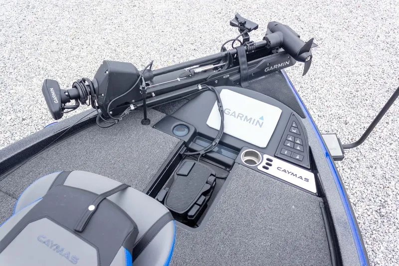 Slide: The Image of 2023 Caymas CX 21 PRO boat deck with Garmin equipment and controls. - 32
