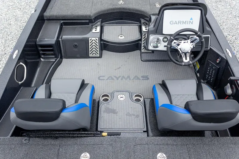 Slide: The Image of 2023 Caymas CX 21 PRO boat interior with Garmin dashboard and dual seating. - 35