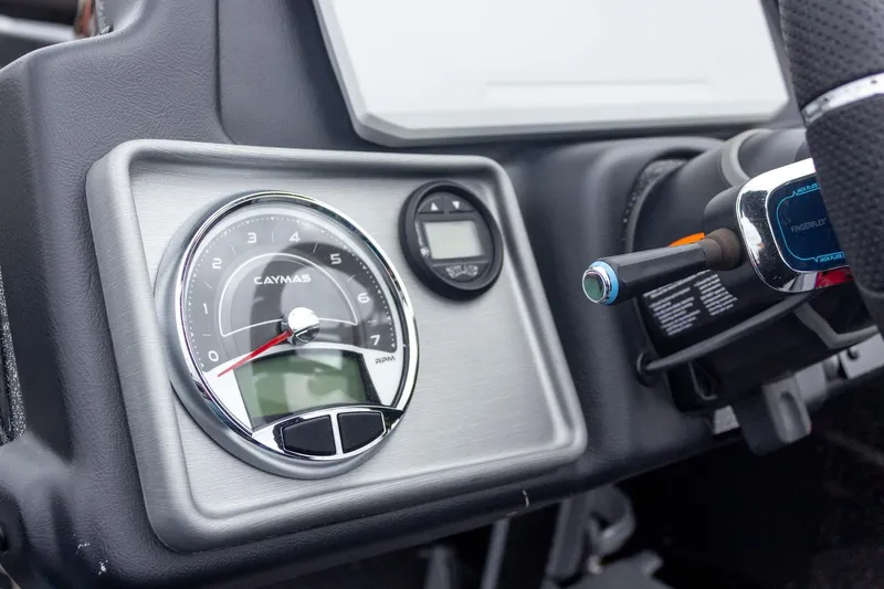Slide: The Image of Dashboard of 2023 Caymas CX 21 PRO boat with RPM gauge and controls. - 38