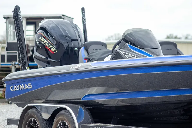 Slide: The Image of 2023 Caymas CX 21 PRO boat with Yamaha VMAX engine, blue and gray design. - 4