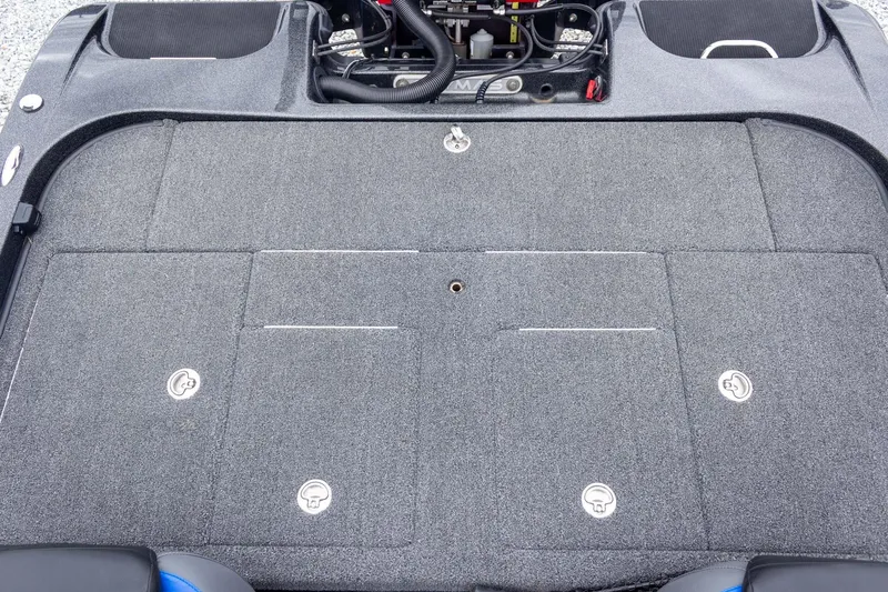 Slide: The Image of 2023 Caymas CX 21 PRO boat deck with storage compartments and carpeted surface. - 43