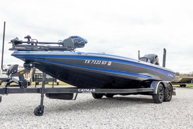 Slide: The Image of 2023 Caymas CX 21 PRO boat on trailer, featuring Garmin equipment. - 9