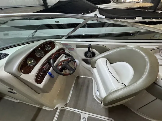 Slide: The Image of Interior view of a 2006 Sea Ray 270 Sundeck boat with helm console. - 14