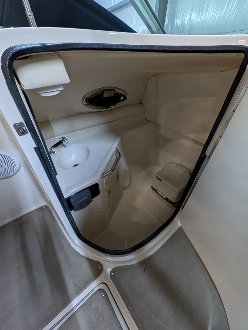 Slide: The Image of Interior of 2006 Sea Ray 270 Sundeck with sink and toilet. - 17