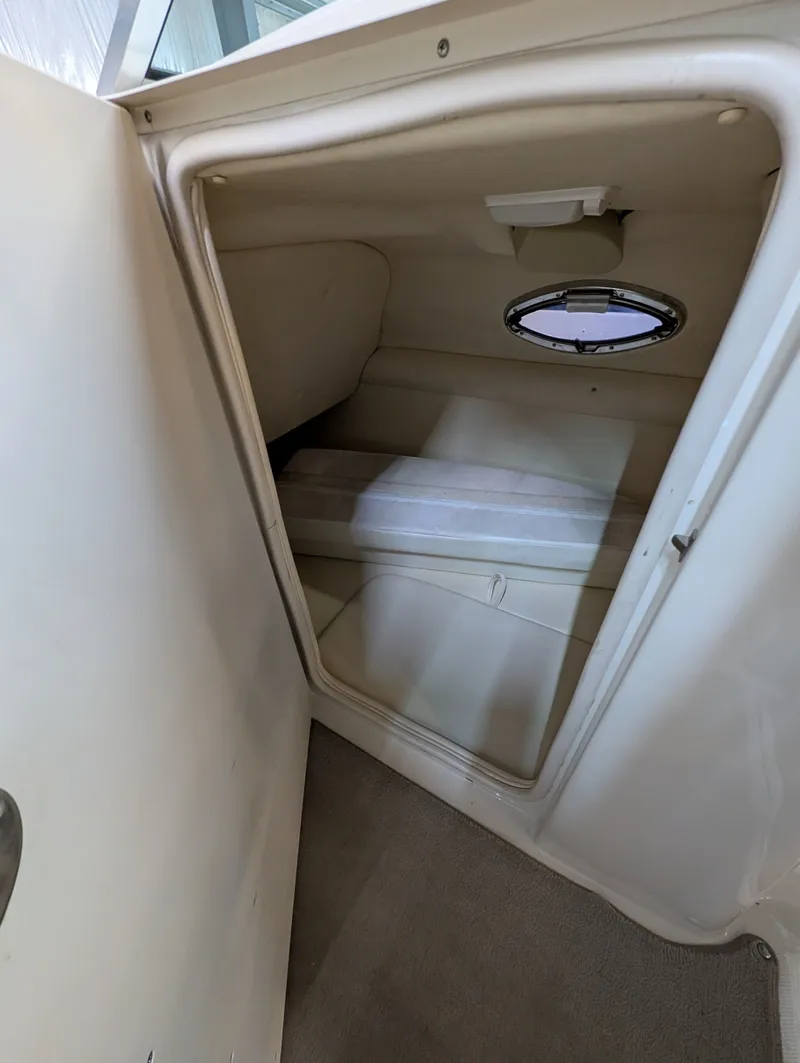 Slide: The Image of Interior of a 2006 Sea Ray 270 Sundeck with porthole. - 18