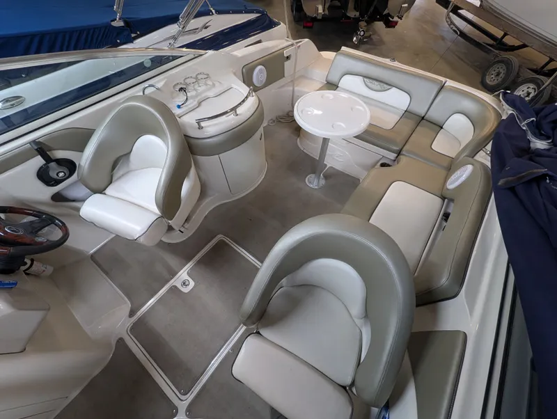 Slide: The Image of Interior of a 2006 Sea Ray 270 Sundeck with seating and table. - 21