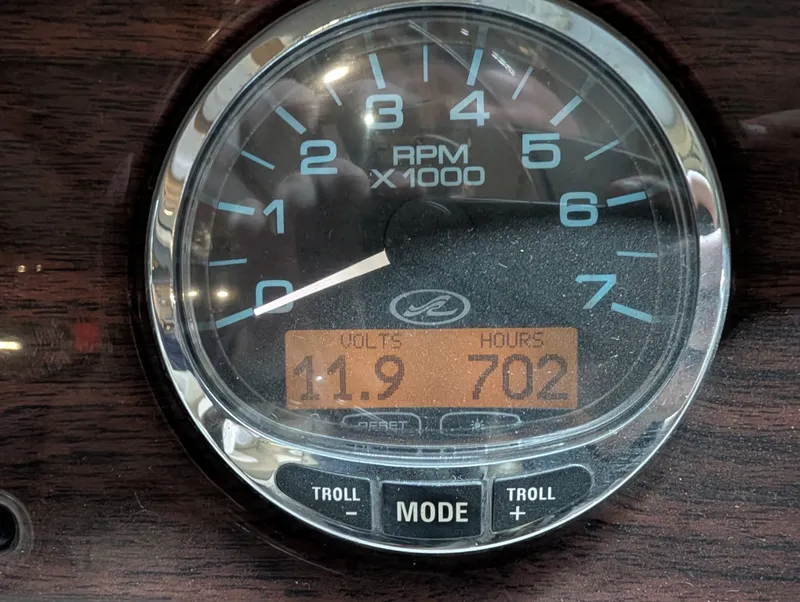 Slide: The Image of Sea Ray 270 Sundeck 2006 tachometer showing 702 hours. - 22