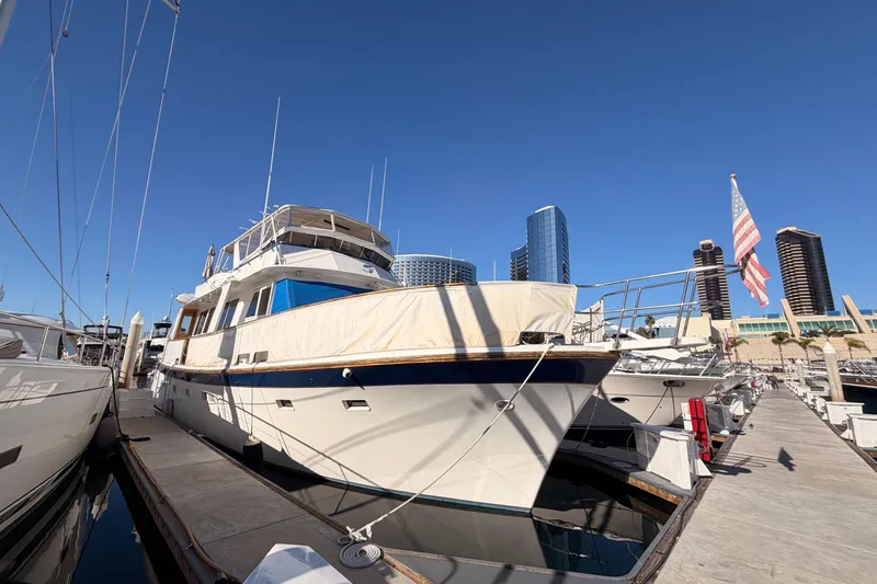 Slide: The Image of 1984 Hartman-Palmer 60 Flush Deck Motor Yacht docked in urban marina. - 0