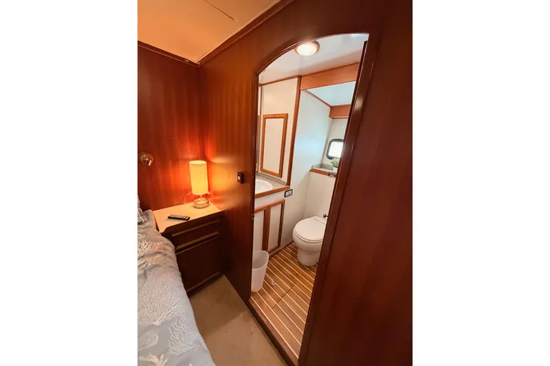 Slide: The Image of 1984 Hartman-Palmer yacht interior with cozy bedroom and ensuite bathroom. - 103