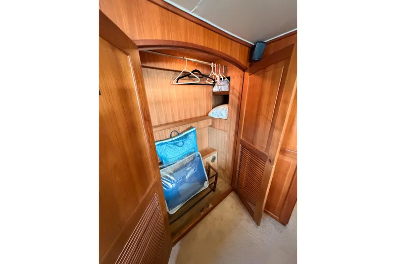 Slide: The Image of Wooden closet interior on 1984 Hartman-Palmer 60 Flush Deck Motor Yacht. - 119