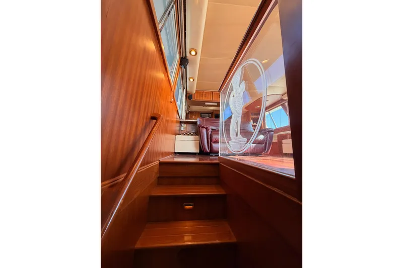 Slide: The Image of Staircase leading to luxurious interior of 1984 Hartman-Palmer 60 Flush Deck Motor Yacht. - 121