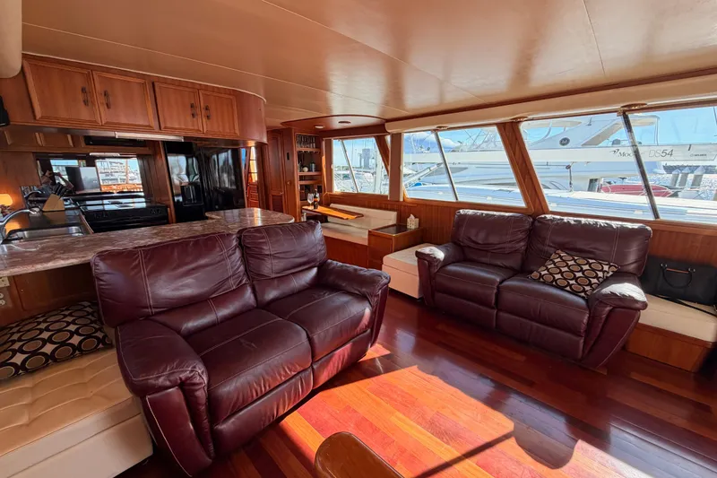 Slide: The Image of Luxurious interior of 1984 Hartman-Palmer 60 Flush Deck Motor Yacht with leather seating and wood finishes. - 122