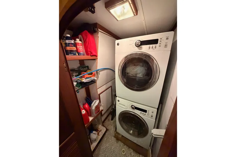 Slide: The Image of Laundry area on 1984 Hartman-Palmer 60 Flush Deck Motor Yacht with stacked washer and dryer. - 126