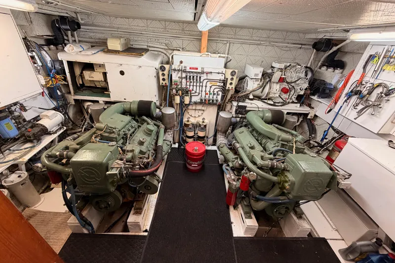 Slide: The Image of Engine room of 1984 Hartman-Palmer 60 Flush Deck Motor Yacht with dual engines and equipment. - 128