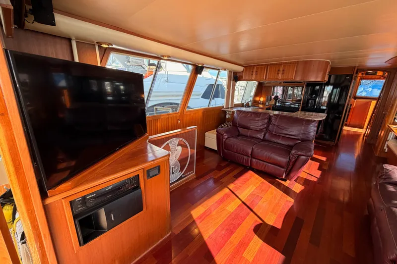Slide: The Image of Luxurious interior of 1984 Hartman-Palmer 60 Flush Deck Motor Yacht with leather seating and wood finishes. - 13