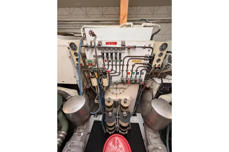 Slide: The Image of Engine room of 1984 Hartman-Palmer 60 Flush Deck Motor Yacht, showing control panel and gauges. - 134