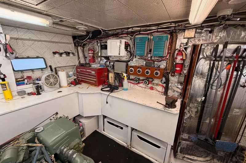 Slide: The Image of Engine room of 1984 Hartman-Palmer 60 Flush Deck Motor Yacht with tools and equipment. - 136