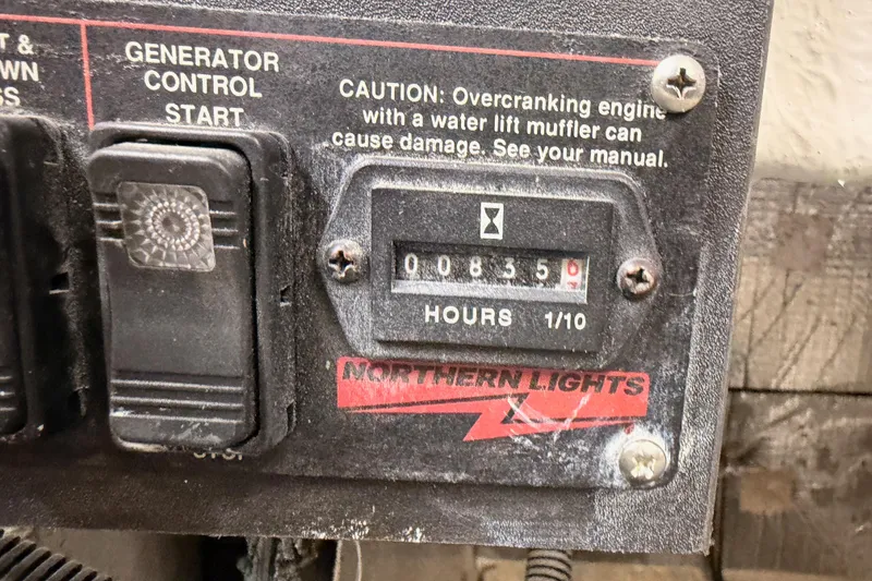 Slide: The Image of Generator control panel with hour meter reading 835.0 on a 1984 Hartman-Palmer yacht. - 139