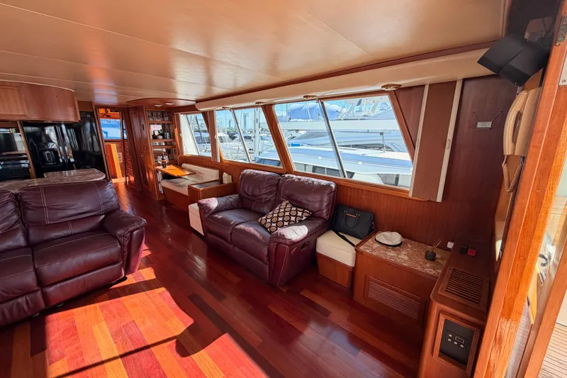 Slide: The Image of Luxurious interior of 1984 Hartman-Palmer 60 Flush Deck Motor Yacht with leather seating and wood finishes. - 14