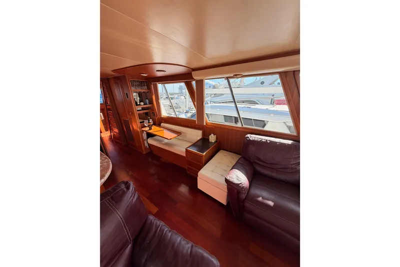 Slide: The Image of Interior of 1984 Hartman-Palmer 60 Flush Deck Motor Yacht with leather seating and wood finishes. - 17